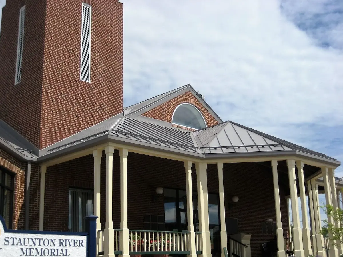 Skilled roofing craftsmen working on a residential roof in Clarendon